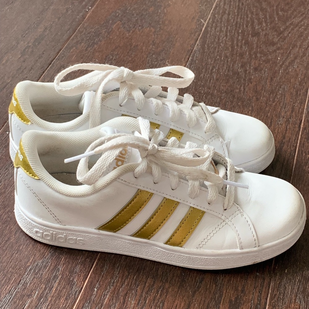 White and gold adidas tennis shoes